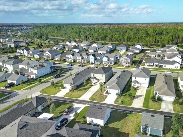 bird's eye view featuring a residential view and a view of trees