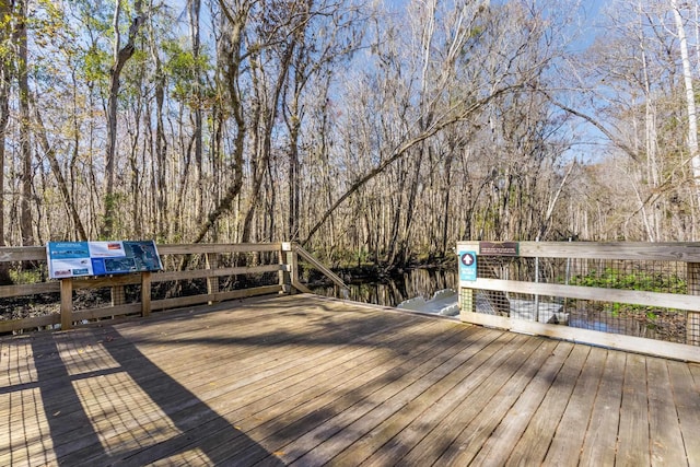 deck featuring a wooded view