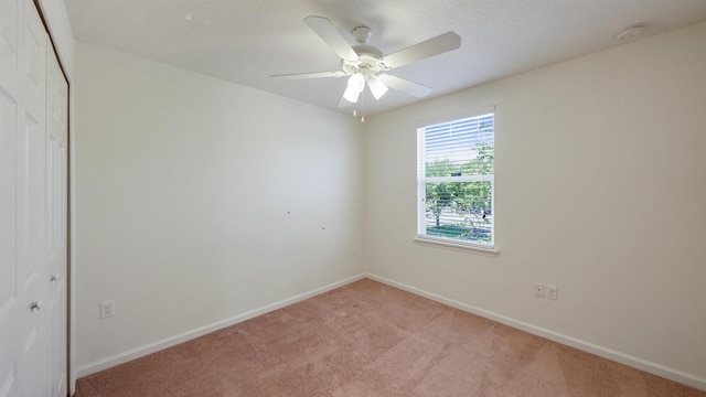 2384 Golden Lake Loop, Saint Augustine, FL 32084 - spare room with light colored carpet, baseboards, and a ceiling fan