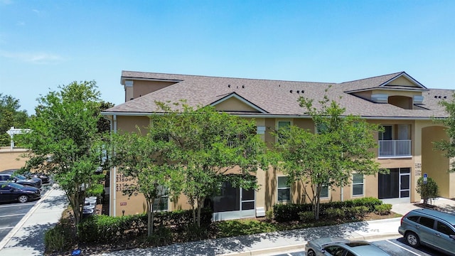 2384 Golden Lake Loop, Saint Augustine, FL 32084 - view of front of property featuring uncovered parking, stucco siding, and roof with shingles