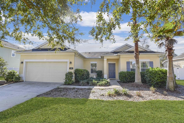 ranch-style house with an attached garage, a front lawn, concrete driveway, and stucco siding