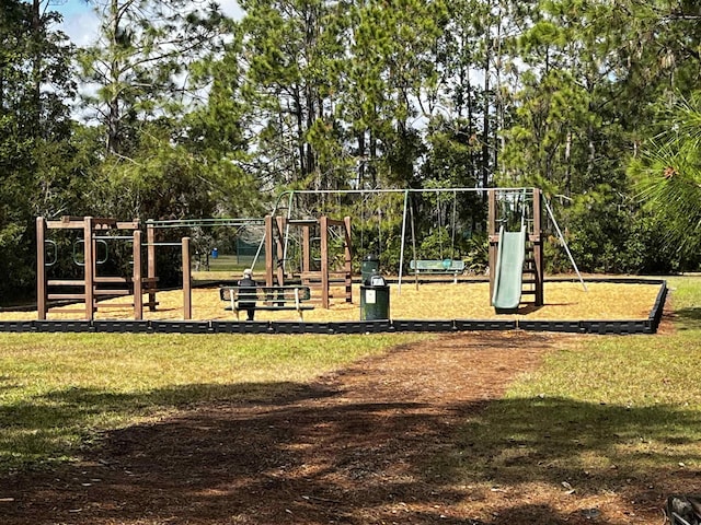 community jungle gym featuring a lawn