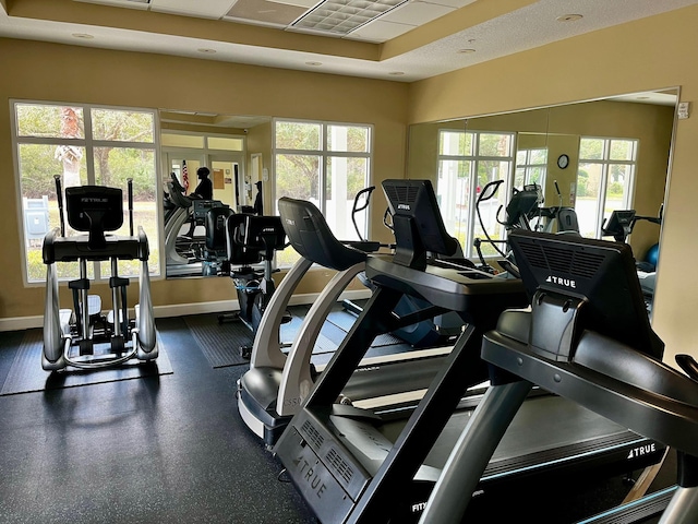 workout area featuring baseboards