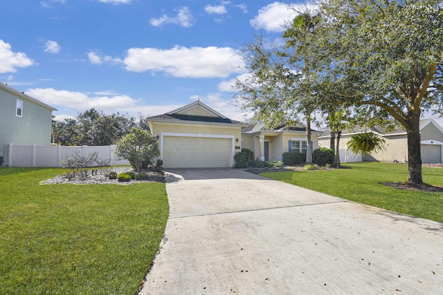 ranch-style house featuring a garage, fence, concrete driveway, stucco siding, and a front lawn