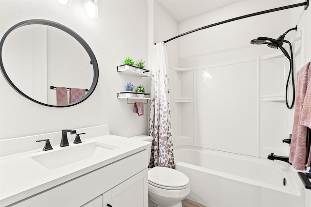 full bathroom with shower / bath combo, vanity, and toilet