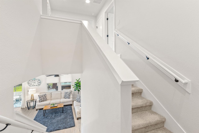 stairway featuring hardwood / wood-style flooring