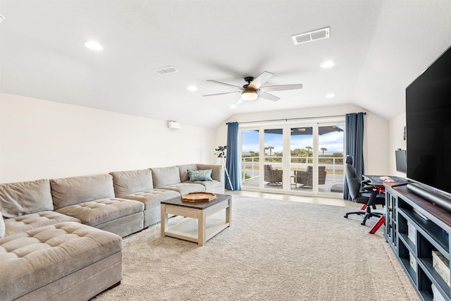 living room with ceiling fan and lofted ceiling