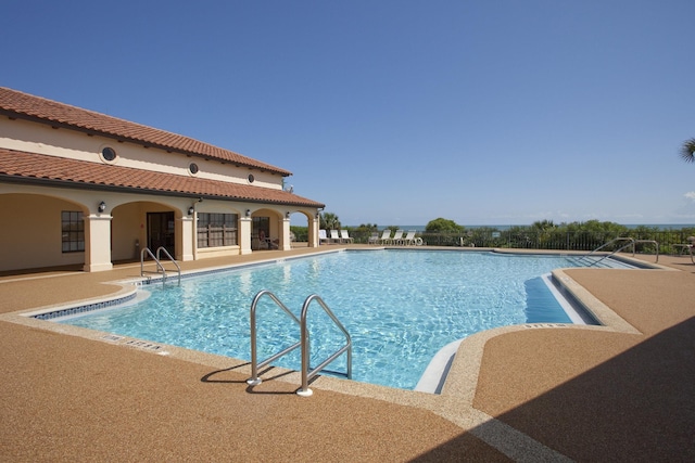 view of swimming pool with a patio area