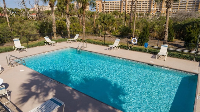 view of swimming pool with a patio