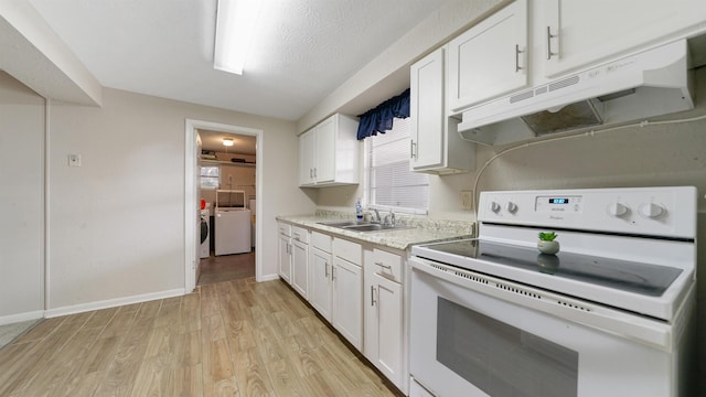 kitchen with white range, sink, washer and dryer, light wood-type flooring, and white cabinetry