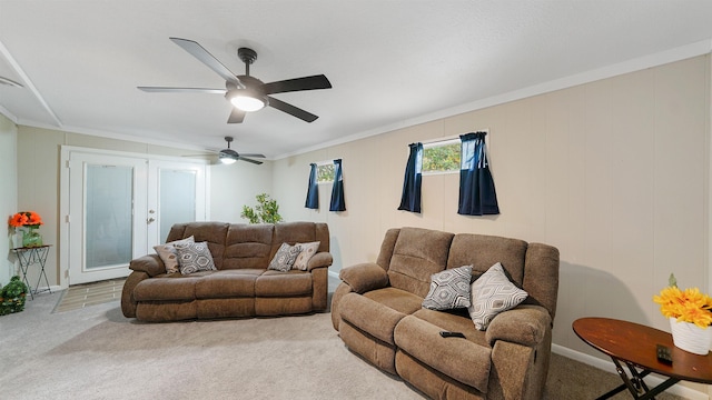 living room featuring crown molding, french doors, carpet, and ceiling fan