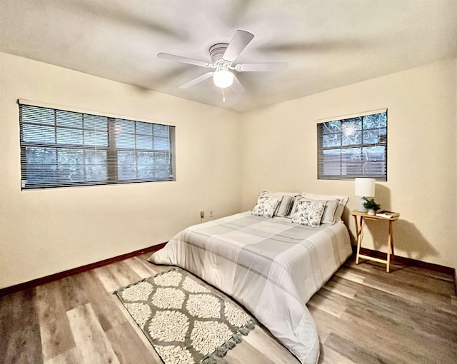 bedroom featuring ceiling fan and wood-type flooring