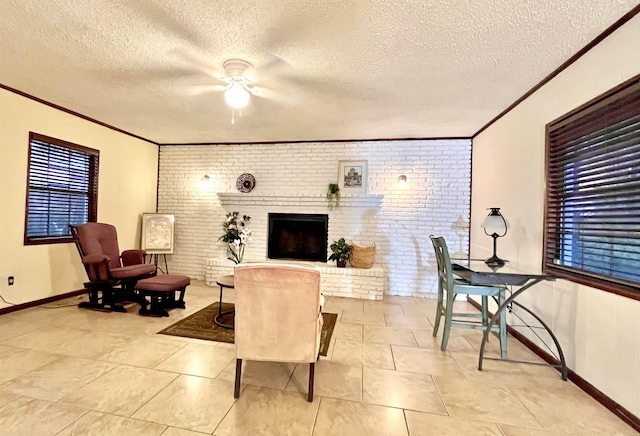 living room featuring ceiling fan, a brick fireplace, light tile patterned flooring, a textured ceiling, and brick wall