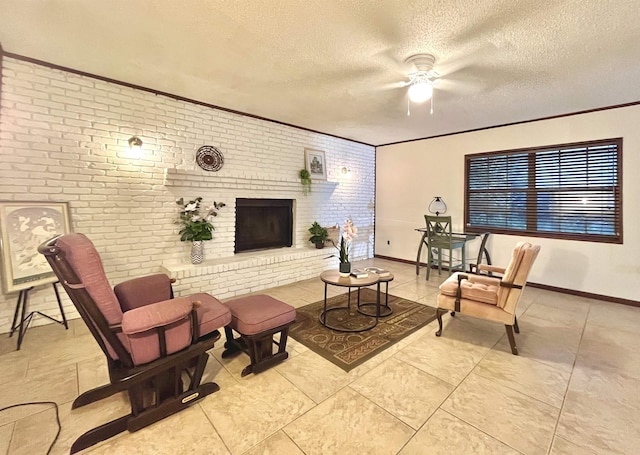 living room with a textured ceiling, brick wall, a fireplace, and baseboards