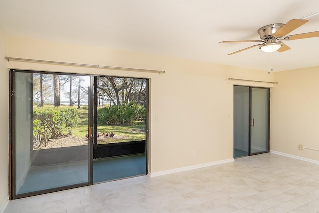 unfurnished room with baseboards and ceiling fan