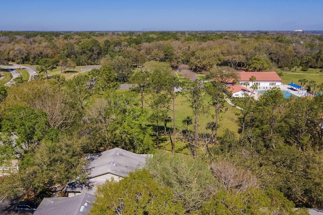 birds eye view of property with a forest view