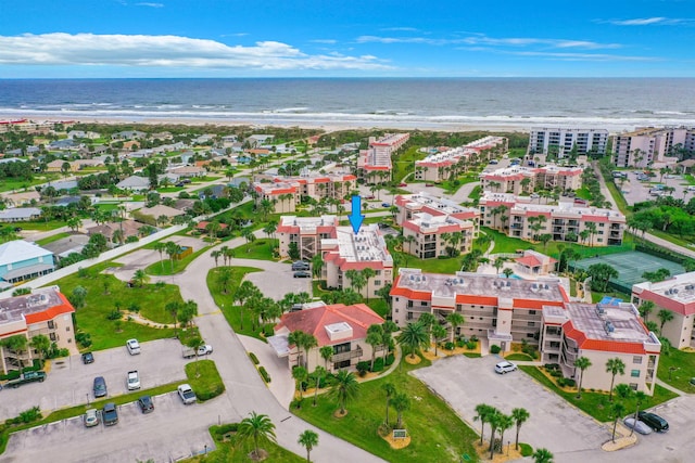 birds eye view of property featuring a water view and a view of the beach