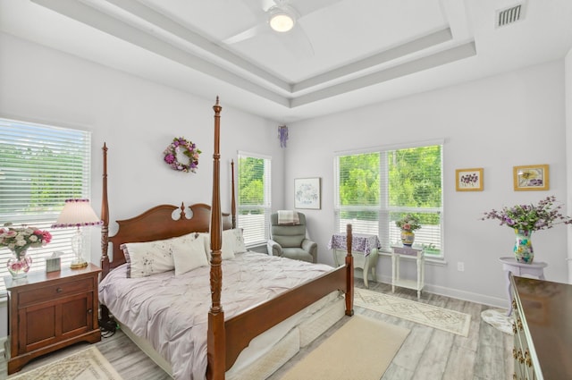 279 Spring Creek Way, Saint Augustine, FL 32095 - bedroom featuring light wood-type flooring, ceiling fan, and a raised ceiling