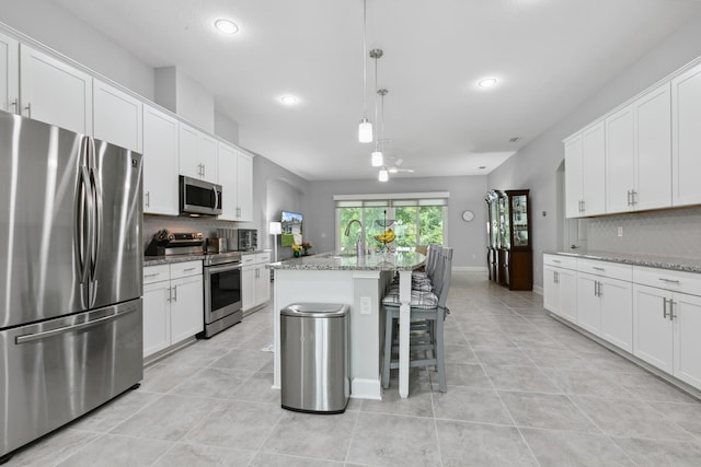 279 Spring Creek Way, Saint Augustine, FL 32095 - kitchen with appliances with stainless steel finishes, backsplash, light tile patterned floors, and recessed lighting