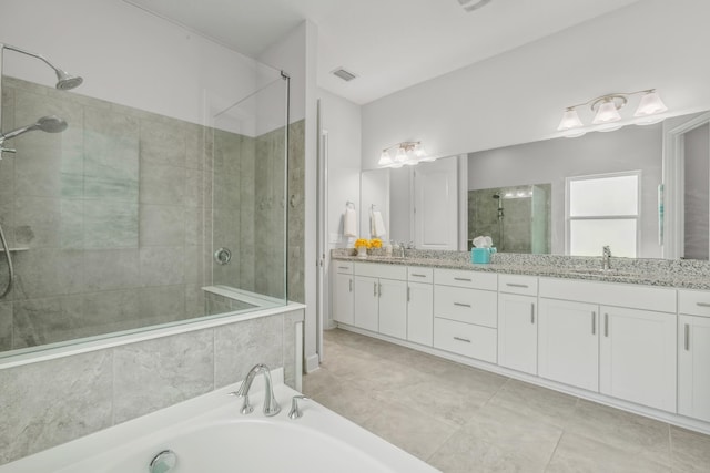 279 Spring Creek Way, Saint Augustine, FL 32095 - full bathroom with tiled shower, double vanity, a bath, and tile patterned floors