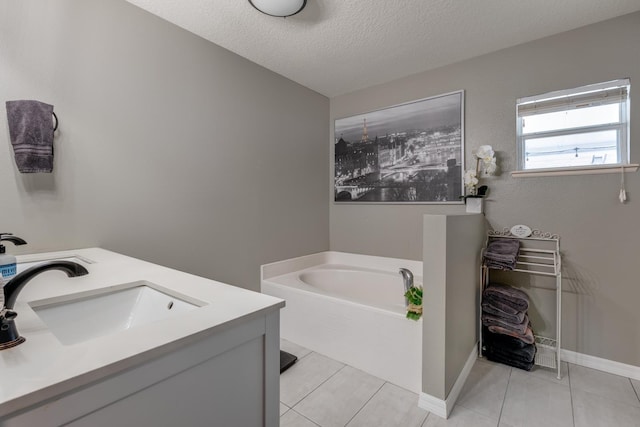 3010 SE 46th Ave, Ocala, FL 34480 - full bath featuring a bath, double vanity, a textured ceiling, tile patterned flooring, and baseboards