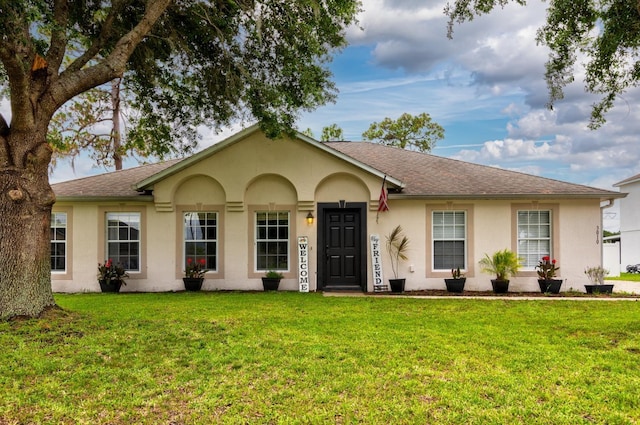 3010 SE 46th Ave, Ocala, FL 34480 - single story home with stucco siding, a front lawn, and a shingled roof