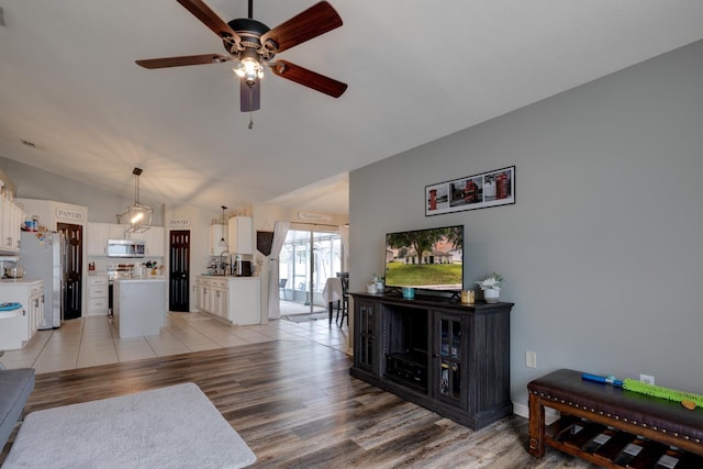 3010 SE 46th Ave, Ocala, FL 34480 - living area with lofted ceiling, ceiling fan, and light wood-style floors
