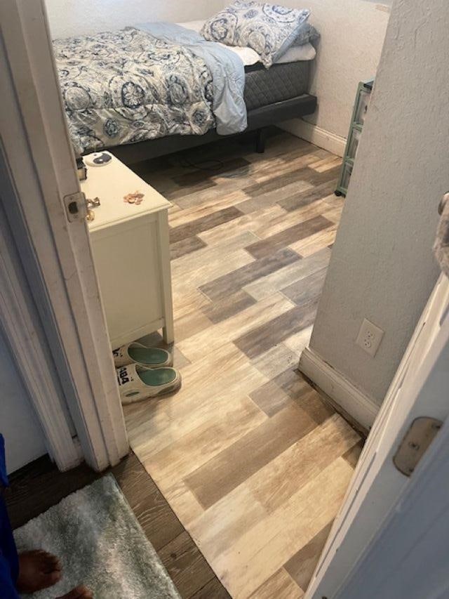 507 S Anderson St, Bunnell, FL 32110 - bedroom featuring wood finished floors and baseboards