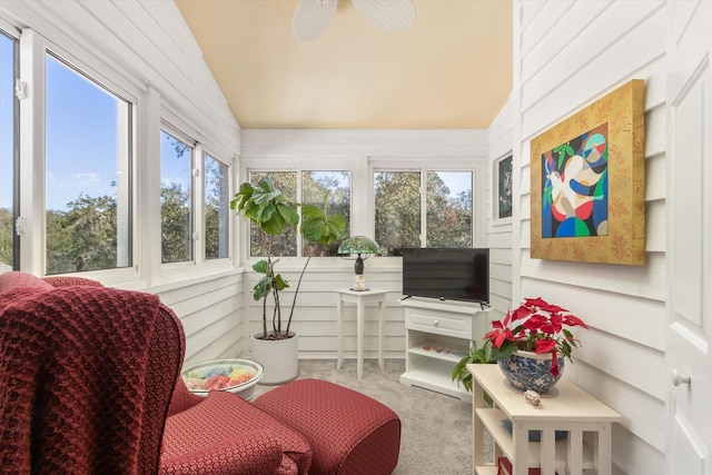 sunroom featuring lofted ceiling