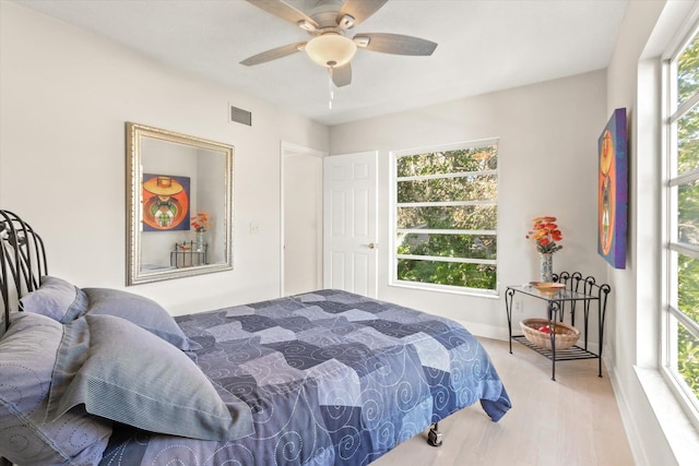 bedroom featuring ceiling fan and light wood-type flooring