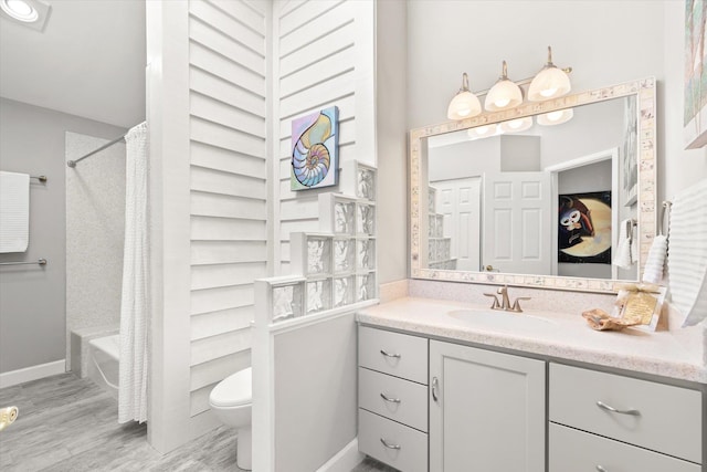 full bathroom featuring shower / tub combo with curtain, vanity, toilet, and hardwood / wood-style floors