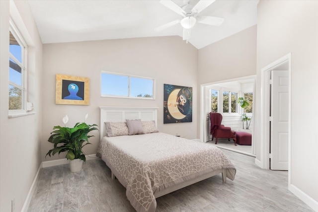 bedroom with vaulted ceiling, hardwood / wood-style floors, and ceiling fan