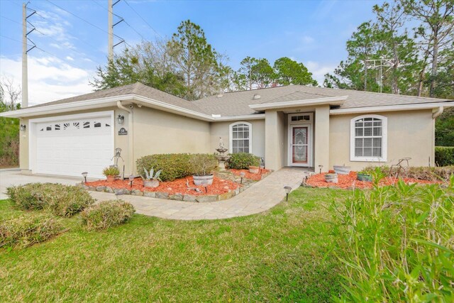 ranch-style home featuring a garage and a front yard