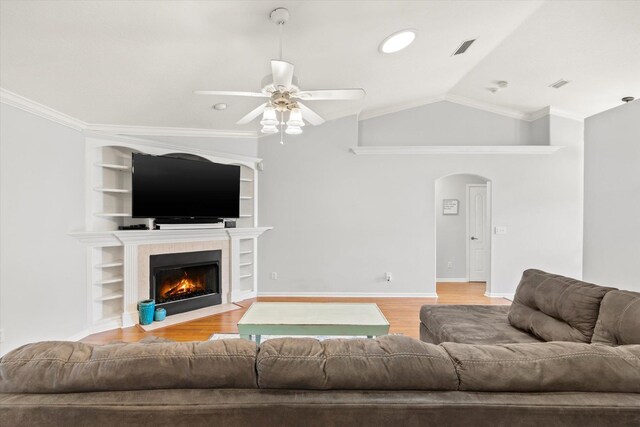 kitchen featuring appliances with stainless steel finishes, sink, vaulted ceiling, and white cabinets