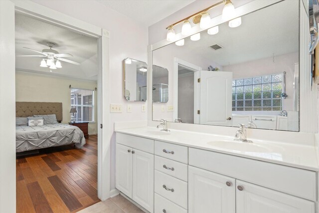 full bathroom with vanity, shower / bath combination with curtain, and toilet