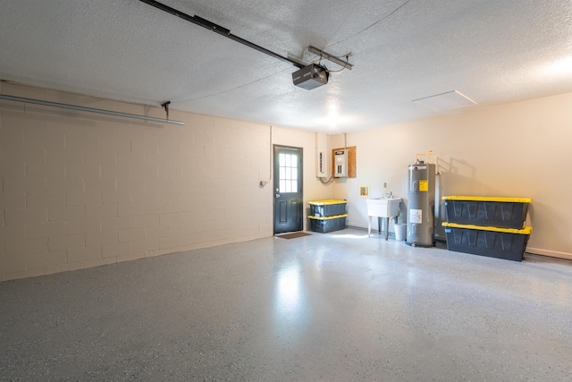 garage with a garage door opener, concrete block wall, water heater, and a sink