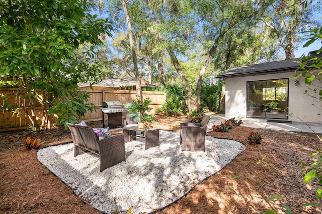 view of patio featuring fence and grilling area