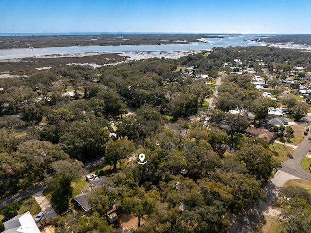 aerial view featuring a water view and a wooded view