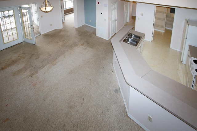 21201 Harbour Vista Cir, Saint Augustine, FL 32080 - unfurnished living room with a sink and light colored carpet
