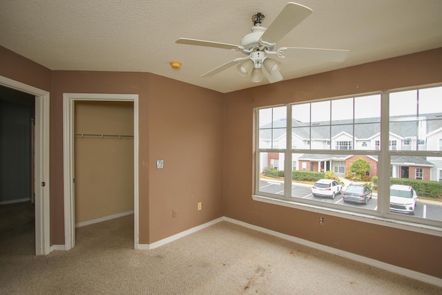 21201 Harbour Vista Cir, Saint Augustine, FL 32080 - unfurnished bedroom featuring a closet, light carpet, and a ceiling fan