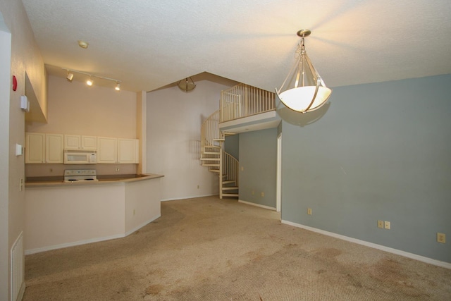 21201 Harbour Vista Cir, Saint Augustine, FL 32080 - unfurnished living room featuring light colored carpet, stairs, and rail lighting