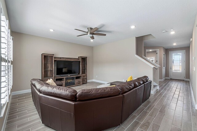 unfurnished room featuring light hardwood / wood-style floors and a textured ceiling