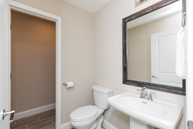 bathroom with sink and toilet