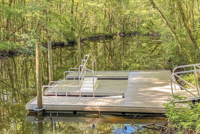 view of dock with a water view