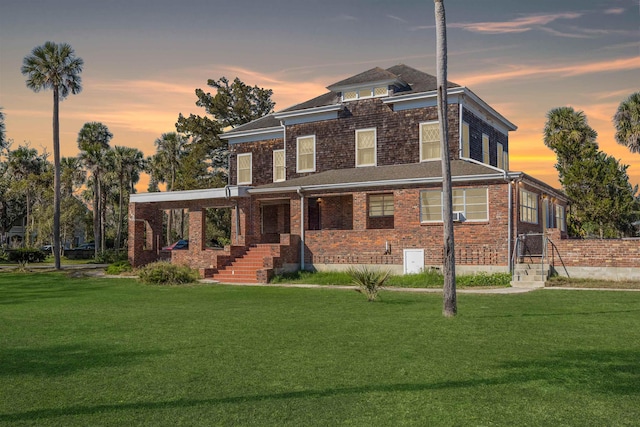 view of front of house with a yard