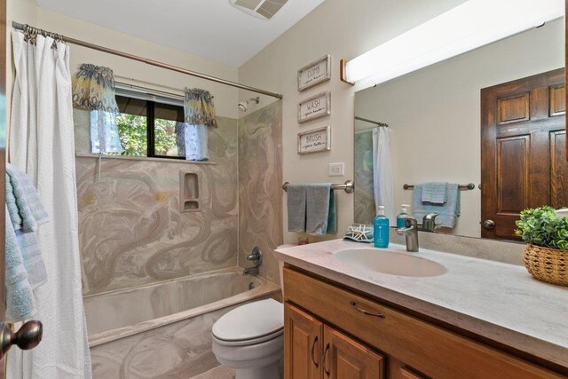 36 Lee Dr, Saint Augustine, FL 32080 - full bathroom featuring shower / bathtub combination with curtain, toilet, and vanity