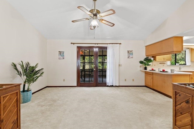 36 Lee Dr, Saint Augustine, FL 32080 - living room featuring light carpet, healthy amount of natural light, baseboards, and a ceiling fan