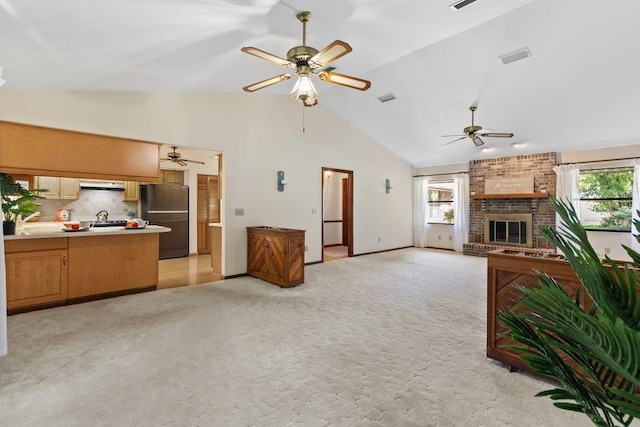 36 Lee Dr, Saint Augustine, FL 32080 - living room with plenty of natural light, a ceiling fan, light carpet, and high vaulted ceiling