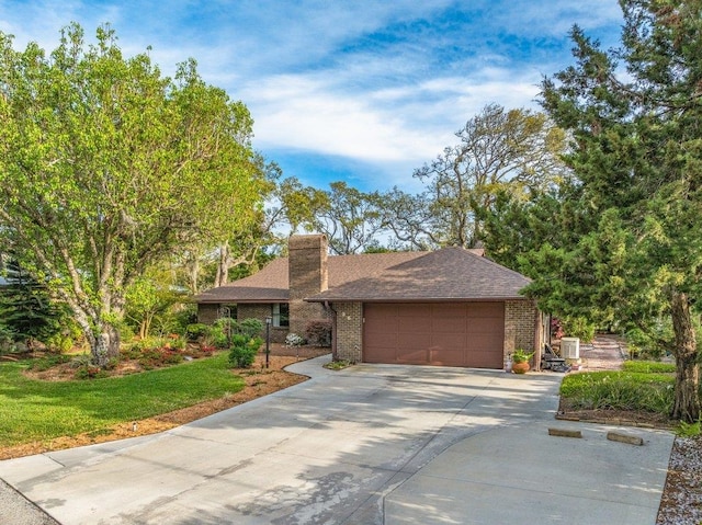 36 Lee Dr, Saint Augustine, FL 32080 - view of front of home with brick siding, an attached garage, driveway, a chimney, and roof with shingles