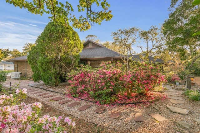 36 Lee Dr, Saint Augustine, FL 32080 - view of home's exterior with a shingled roof and brick siding